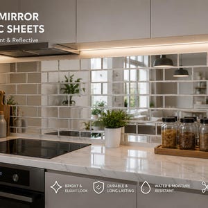 Puede incluir: Láminas de acrílico espejo plateado instaladas como salpicadero de cocina en patrón de ladrillo. La superficie reflectante muestra una encimera con estufa, plantas y frascos. Texto: SILVER MIRROR ACRYLIC SHEETS, Modern, Elegant & Reflective.
