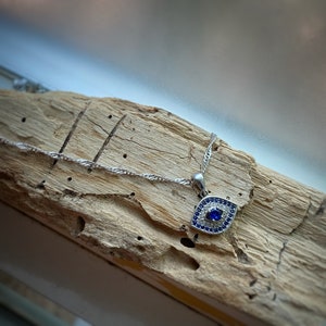 Sterling Silver Evil Eye Charm Pendant Necklace w/ clear and blue cubic zirconia on sterling silver chain - rhodium plated, with a gift bag