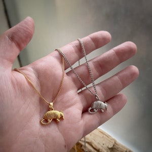 Armadillo Charm Pendant Necklace comes in gold or rhodium w/ 5 chain options, comes in velvet gift bag. Charm only avail. too.