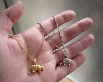Armadillo Charm Pendant Necklace comes in gold or rhodium w/ 5 chain options, comes in velvet gift bag. Charm only avail. too.