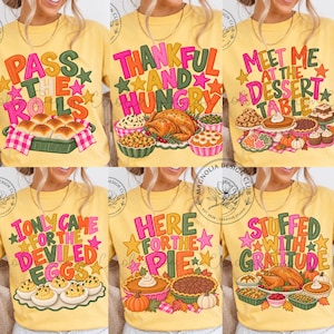 May include: A collage of six yellow t-shirts featuring Thanksgiving-themed graphics and text. Designs include 'Pass the rolls', 'Thankful and hungry', 'Meet me at the dessert table', 'I only came for the deviled eggs', 'Here for the pie', and 'Stuffed with gratitude'.