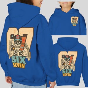May include: Royal blue hoodie featuring a distressed graphic of a skeleton wearing sunglasses and a baseball cap, with the text "SIX SEVEN". The number "67" is also displayed. The design is repeated on the back and a smaller version on the hood.