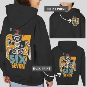 May include: Black hoodie with a skeleton graphic on the back and a smaller version on the front. The skeleton wears sunglasses and a baseball cap with the number "67". The text "SIX SEVEN" is below the skeleton in blue and yellow.