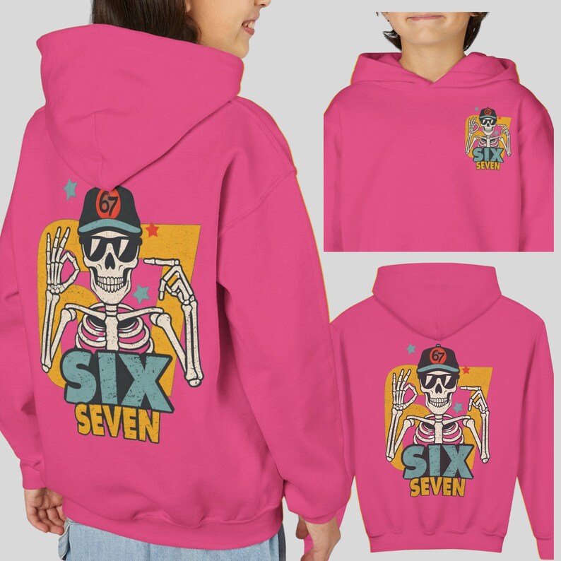 May include: Hot pink hoodie featuring a skeleton graphic with sunglasses and a baseball cap. The graphic includes the text "SIX SEVEN" in blue and yellow. The hoodie has a hood and a kangaroo pocket.