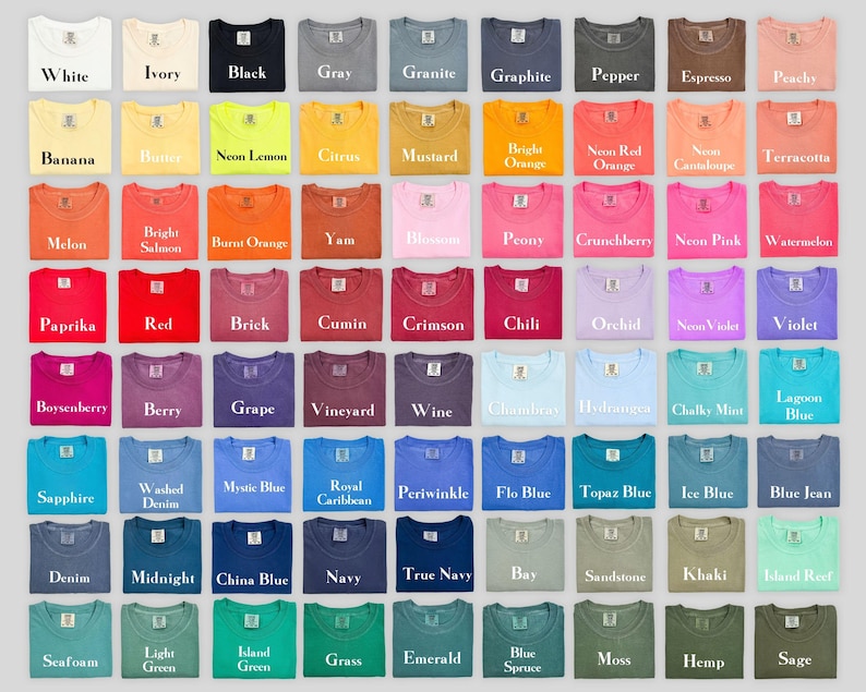 May include: A grid of seventy-two t-shirts displayed in various colors, each featuring a small rectangular label at the neckline. The colors include white, ivory, black, gray, granite, graphite, pepper, espresso, peachy, banana, butter, neon lemon, citrus, mustard, bright orange, neon red orange, neon cantaloupe, terracotta, melon, bright salmon, burnt orange, yam, blossom, peony, crunchberry, neon pink, watermelon, paprika, red, brick, cumin, crimson, chili, orchid, neon violet, violet, boysenberry, berry, grape, vineyard, wine, chambray, hydrangea, chalky mint, lagoon blue, sapphire, washed denim, mystic blue, royal caribbean, periwinkle, flo blue, topaz blue, ice blue, blue jean, denim, midnight, china blue, navy, true navy, bay, sandstone, khaki, island reef, seafoam, light green, island green, grass, emerald, blue spruce, moss, hemp, and sage.