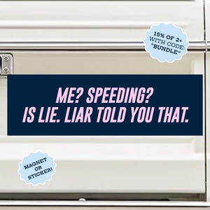 May include: A rectangular bumper sticker or magnet with a dark blue background and light pink text that reads: ME? SPEEDING? IS LIE. LIAR TOLD YOU THAT. The product is displayed on the white tailgate of a vehicle, featuring a light blue circular badge.