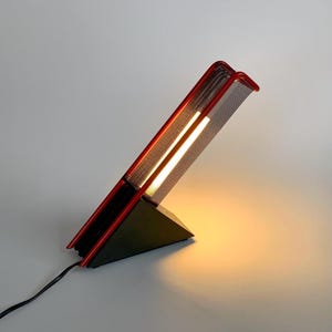 80s vintage Memphis Milano style neon table lamp in black & glossy red, Philips, made in France. Mid century modern working desk lamp.