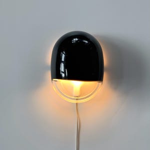 ON HOLD: 80s vintage black & clear “pebble” shape wall lamp, iGuzzini, Italy. Mid century Italian modern designer light, space age design.