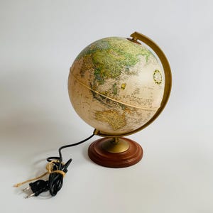 90s rare vintage illuminated standing globe from De Agostini, Italy. Italian postmodern design, retro looking desktop globe with lighting.