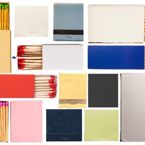 May include: Assortment of matchboxes in various colors and designs, including red, blue, yellow, green, and white. Some matchboxes have a plain design, while others feature a pattern of matches.