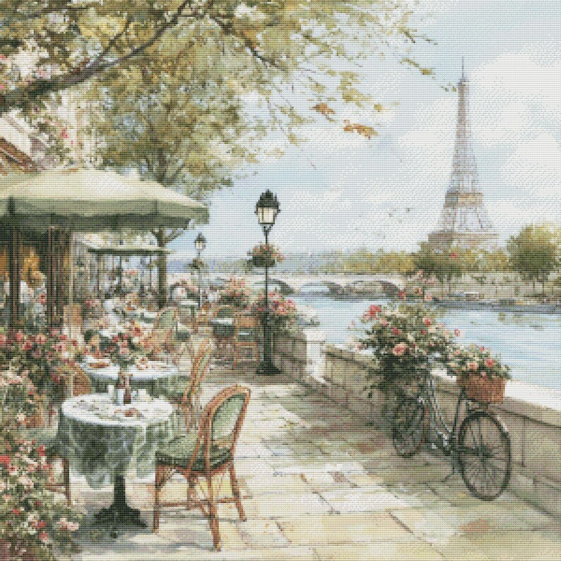 May include: A detailed painting of a Parisian cafe scene. Tables with green tablecloths and chairs are set up on a stone patio. The Eiffel Tower is visible in the background, along with a bicycle with a basket of flowers.