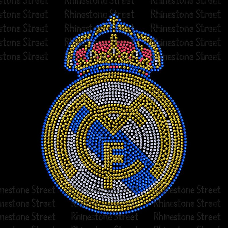 May include: A rhinestone-studded design of a football team logo with a crown on top. The logo is in shades of blue, white, and gold.