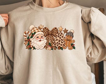 Camiseta navideña con estampado de leopardo, camiseta gráfica de Papá Noel con pan de jengibre y árbol con estampado animal, sudadera navideña de invierno adorable, regalo de Navidad para mujer.