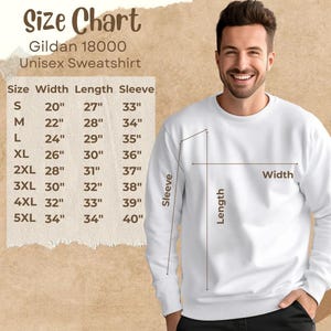a man wearing a white sweatshirt with measurements