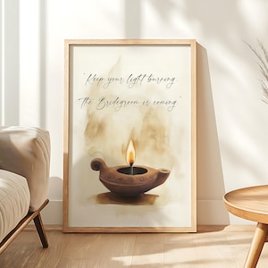 May include: A framed print featuring a watercolor illustration of a brown oil lamp with a lit flame. The artwork includes the text "Keep your light burning: The Bridegroom is coming" in elegant script. The frame is a light wood color.