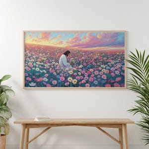May include: A painting of a man in a white robe sitting in a field of pink and purple flowers. The sky is a soft pink and orange.
