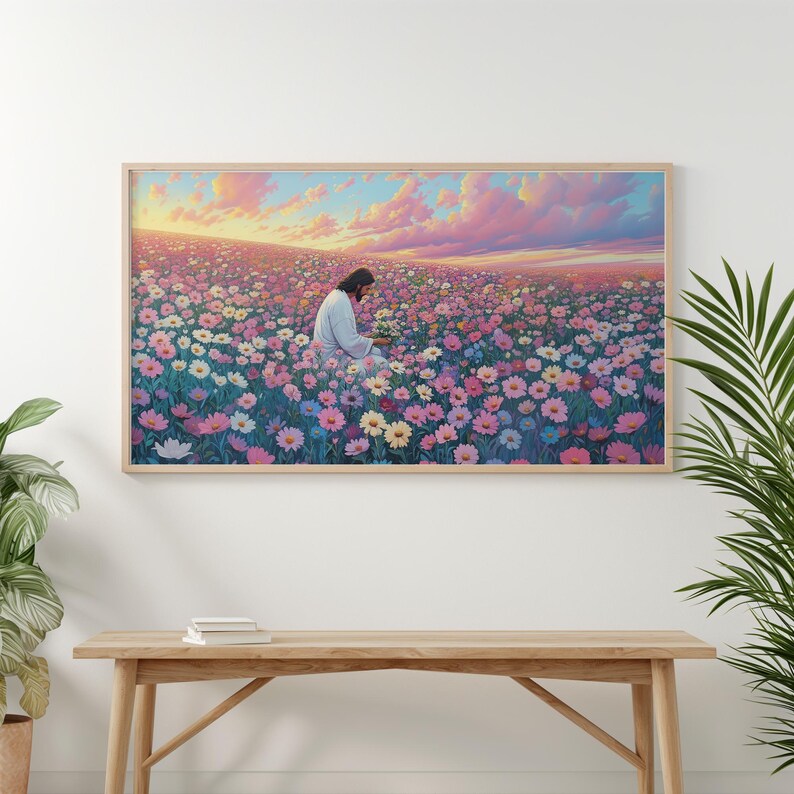 May include: A painting of a man in a white robe sitting in a field of pink and purple flowers. The sky is a soft pink and orange.