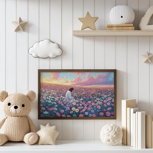 May include: A framed print of a painting depicting a man in white clothing kneeling in a field of pink, white, and blue flowers. The sky is a vibrant pink and orange with clouds.