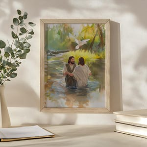 May include: A framed painting depicting a religious scene of two men standing in a river. One man is pouring water over the other man's head. A white dove is flying above them. The painting is set against a backdrop of lush greenery.