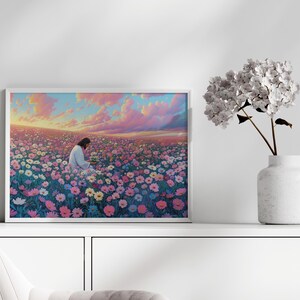 May include: A framed painting depicting a person in white clothing sitting in a field of pink, white, and blue flowers. The sky is a vibrant pink and orange with clouds.