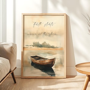 May include: A framed art print featuring a watercolor painting of a wooden boat floating on calm water. The sky is a blend of yellow and gray, with the text "Faith floats - even in the storm." The frame is a light wood color.