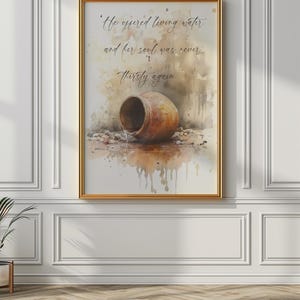 May include: A watercolor painting of a clay pot with water pouring out of it. The painting has a quote that reads "He offered living water and her soul was never thirsty again."