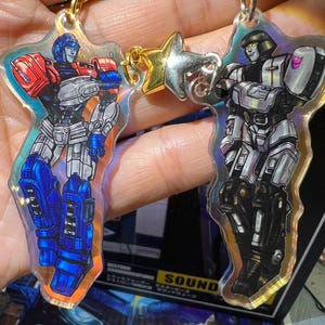 D-16 + Orion Pax bijpassende magnetische sleutelhangers [Transformers ONE]