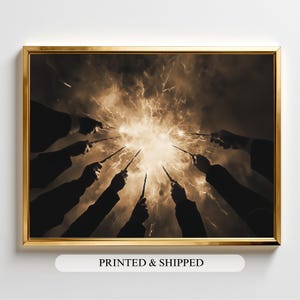 May include: Sepia-toned framed print featuring multiple hands holding wands, converging towards a bright, central light burst. The wands are pointed towards the center, creating a dramatic effect. The frame is gold. The text "PRINTED & SHIPPED" is at the bottom.