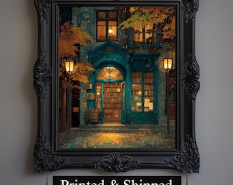 May include: A framed print of a cozy bookstore scene at night. The teal-colored building has an arched doorway and is lit by warm interior lights and street lamps. The black frame has ornate detailing.