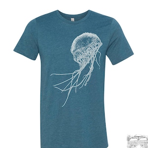 May include: A teal blue t-shirt with a white outline of a jellyfish on the front.