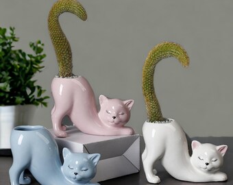 Maceta de cerámica para suculentas con forma de gato, ideal como regalo para amantes de los animales.