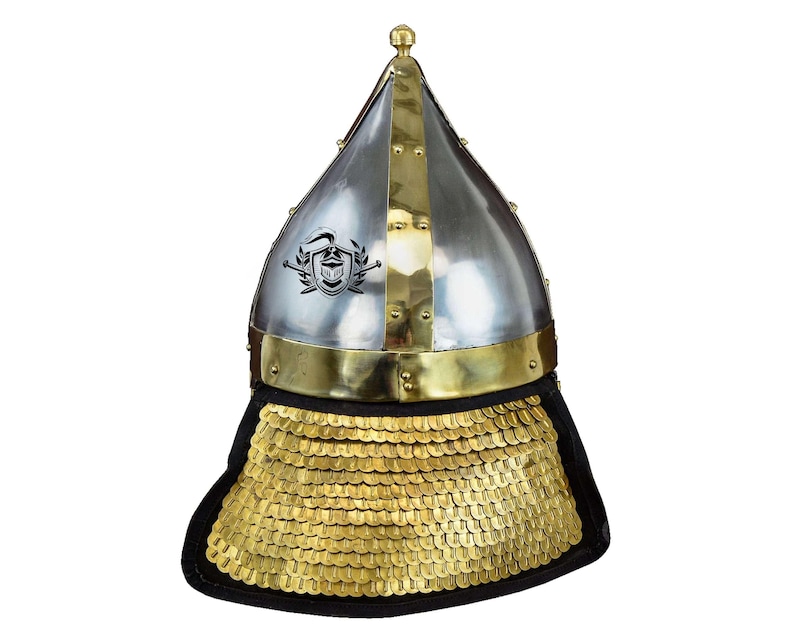 May include: A silver and brass helmet with a pointed top and a gold chainmail neck guard. The helmet has a decorative design on the front.