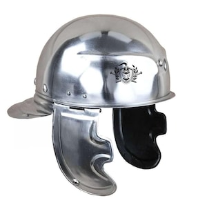 May include: A silver Roman helmet with a black crest and a black leather chin strap. The helmet has a rounded top and a visor that can be raised or lowered.