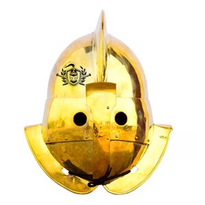 May include: A gold helmet with a pointed crest and a decorative design on the front. The helmet has a visor and ear flaps.