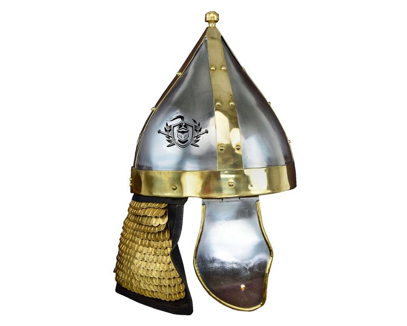 May include: A silver and gold helmet with a pointed top and a chainmail neck guard. The helmet has a decorative design on the front.