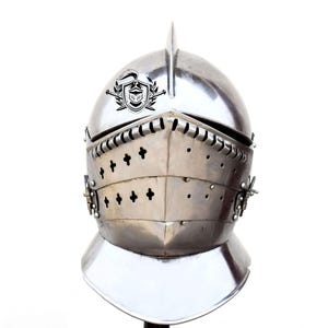 May include: A silver knight's helmet with a crest and a visor. The helmet has a decorative design with small crosses on the front.