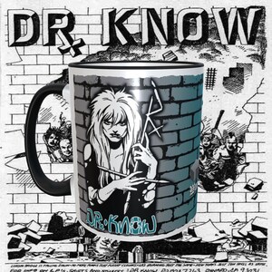 May include: A black and white mug with a black handle. The mug has a graphic of a woman with long hair and a brick wall background. The text "DR. KNOW" is printed on the mug in a blue and white font.