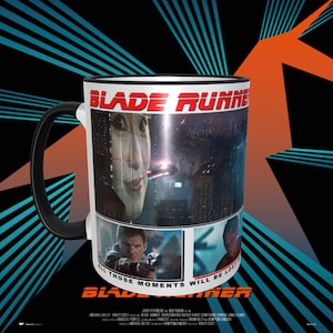 May include: A white ceramic mug with a black handle. The mug features a collage of images from the film Blade Runner. The text "Blade Runner" is printed in red letters on the top of the mug. The text "All those moments will be lost in time, like tears in rain." is printed in black letters on the bottom of the mug.