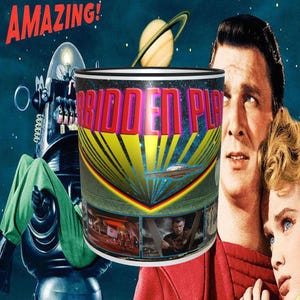 May include: A white ceramic mug with a black rim and handle. The mug features a colorful graphic of a flying saucer and the text "Forbidden Planet".