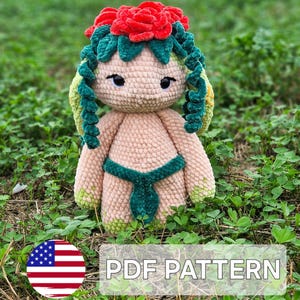 May include: A handmade crochet doll with a floral headpiece and green accents. The doll has a light tan body, green hair, and a green bikini. The image includes the text "PDF PATTERN".