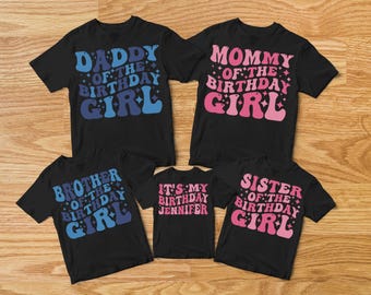 May include: Set of five black t-shirts with colorful text. The shirts say "Daddy of the Birthday Girl", "Mommy of the Birthday Girl", "Brother of the Birthday Girl", "It's My Birthday Jennifer", and "Sister of the Birthday Girl".