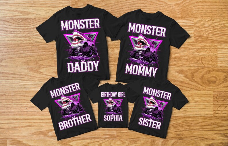 May include: Black t-shirts with a monster truck design featuring a shark head. The shirts have the words "MONSTER" and "DADDY", "MOMMY", "BROTHER", "SISTER", and "BIRTHDAY GIRL SOPHIA" in white.