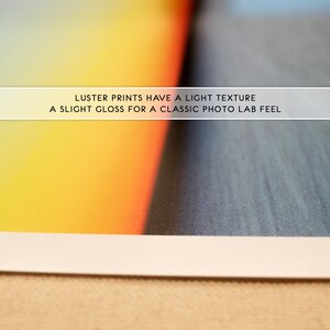 May include: Close-up of a photo print with a slight gloss finish. The text on the print reads "Luster prints have a light texture. A slight gloss for a classic photo lab feel."
