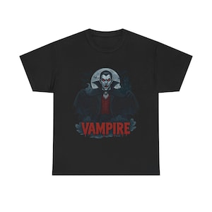 May include: A black t-shirt with a graphic of a vampire with red eyes and fangs. The vampire is standing in front of a full moon and bats are flying around him. The text 