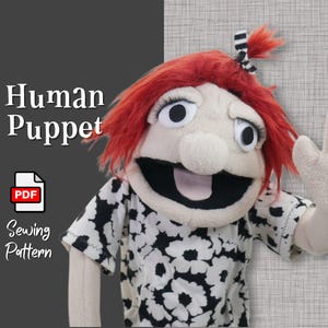 Puede incluir: Una marioneta humana hecha a mano con cabello rojo, ojos grandes y una camisa floral en blanco y negro. La marioneta tiene una boca ancha y abierta y una mano levantada en señal de saludo. Se muestra el texto "Human Puppet" y "Sewing Pattern".