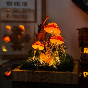 Hand painted pink and orange mushroom night light with tree trunk, dried flowers and moss, on wooden base - fairy garden tabletop decor