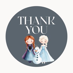 May include: A round thank you sticker with a gray background. The sticker features two cartoon girls with long blonde hair, wearing blue dresses, and a snowman. The text "THANK YOU" is written in white letters on the sticker.