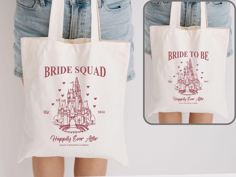May include: Two white canvas tote bags with pink text and a pink outline of Cinderella's castle. The bag on the left says "Bride Squad" and the bag on the right says "Bride to Be". Both bags have the text "Happily Ever After" and the year 2024.
