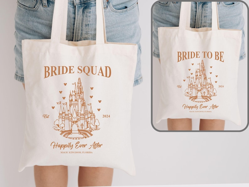 May include: Two white canvas tote bags with brown text and a line drawing of Cinderella's castle. The bag on the left says "Bride Squad" and the bag on the right says "Bride to Be". Both bags have the text "Happily Ever After" and the year "2024" printed on them.