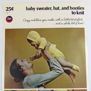 May include: A vintage knitting pattern featuring a yellow baby sweater, hat, and booties. The pattern is titled "baby sweater, hat, and booties to knit" and includes the text "Cozy cuddlers you make with a little bit of effort... and a whole lot of love!"